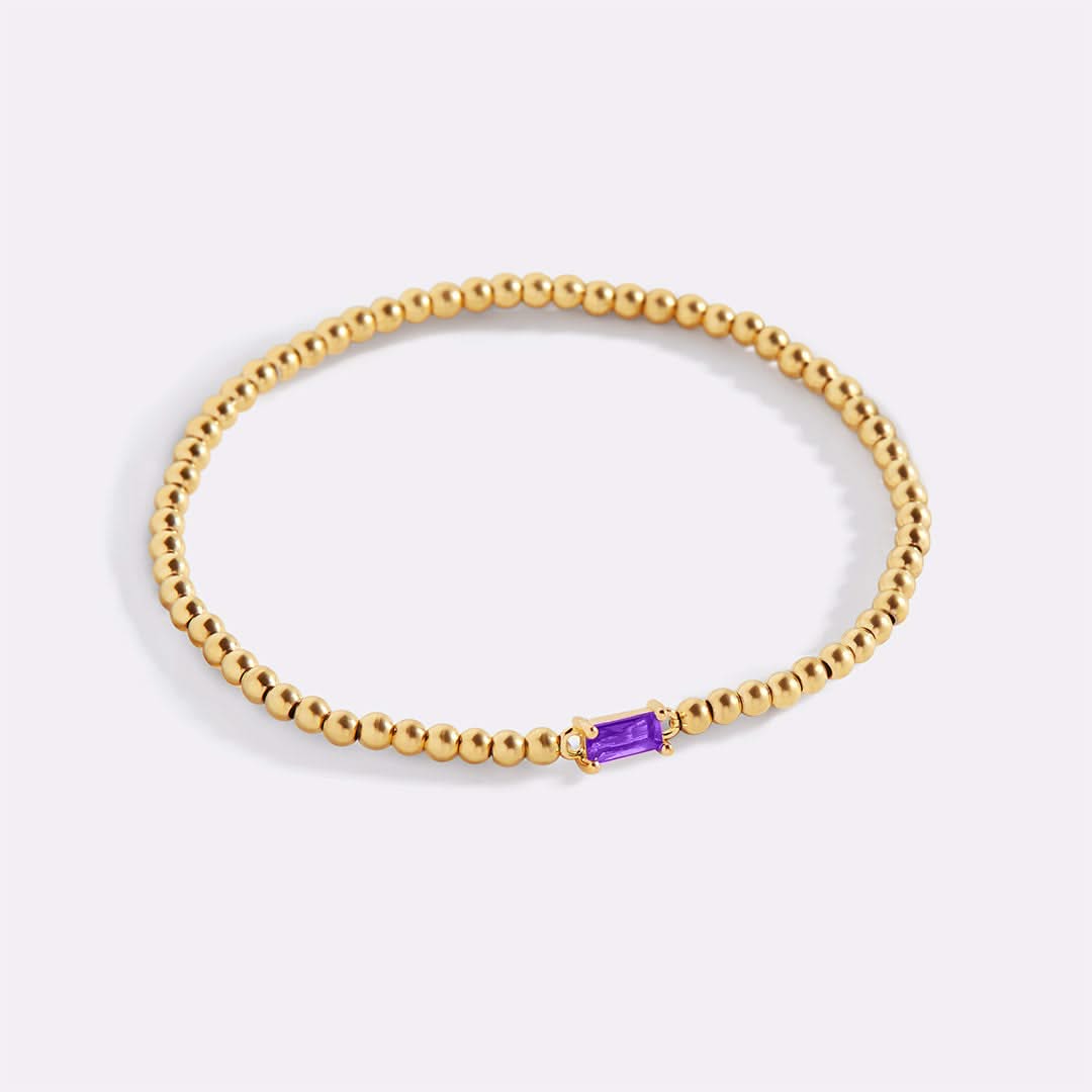 Bracelet of gold beads with birth stone